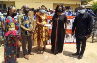 A photo of the principal of the school receiving the donation on behalf of the school