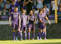 Ashimeru (third left) congratulated by teammates