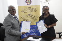 Prof. Dorothy Yeboah Manu, Director, NMIMR (right) with Dr William Collins Asare of COVID Fund