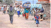 People from the Democratic Republic of Congo cross the Ugandan border to seek refuge