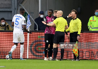 Ghanaian player Aaron Opoku complains to the referees