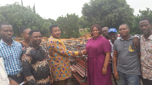 Hon. Adelaide Yaa Agyeiwaa Ntim donating the desks to school authorities