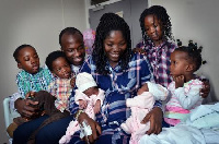 Elated Mr and Mrs Adama with their children