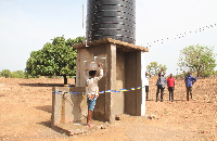 A woman fetching water from one of the mechanized borehole at Katiu-Saa