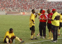 Former Asante Kotoko coach, Hans Dieter Schmidt talking to his players during 2004 Confed final