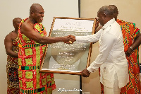 Azumah Nelson receiving the citation from  Odeneho Kwafo Akoto III