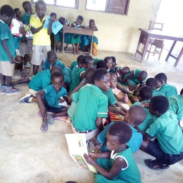 Pupils sitting on the floor during class lessons