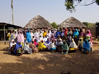 Mr. Austin poses with beneficiaries of the two groups in Bognaayili