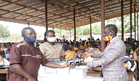 The district minister, Pastor Samuel Aboagye Yirenkyi presenting the mathematical sets