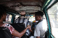 File photo of passengers in a commercial vehicle