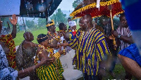 Vice President of Ghana,  Dr Mahamudu Bawumia  in the rain exchanging pleasantries