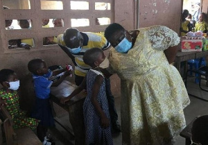 Gertrude Naa Amponsah Ankrah intereacting with pupils