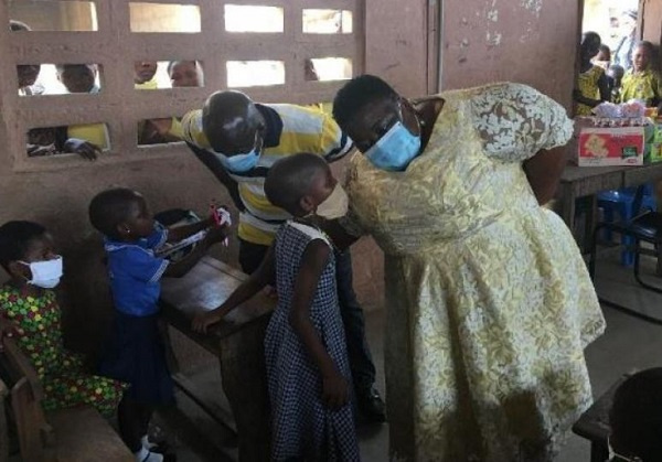 Gertrude Naa Amponsah Ankrah intereacting with pupils