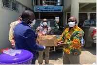 Dr. Audu Rauf receiving the items from Pharmatrust