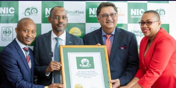 Superbrands East Africa project director Jawad Jaffer (second right) handing over an award