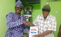 Abdallah Otito Achuliwor (left) receiving his nomination form