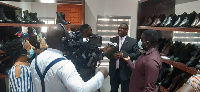 Dr Karl Laryea speaking to the media