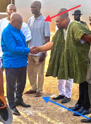 The regional minister (arrowed) is said to have been shabbily dressed when he met the president