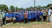 Samuel Asare Akuamoah, in a photograph with some students