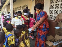 Member of Parliament for Agona East, Queenstar Pokua Sawyerr  ad some students