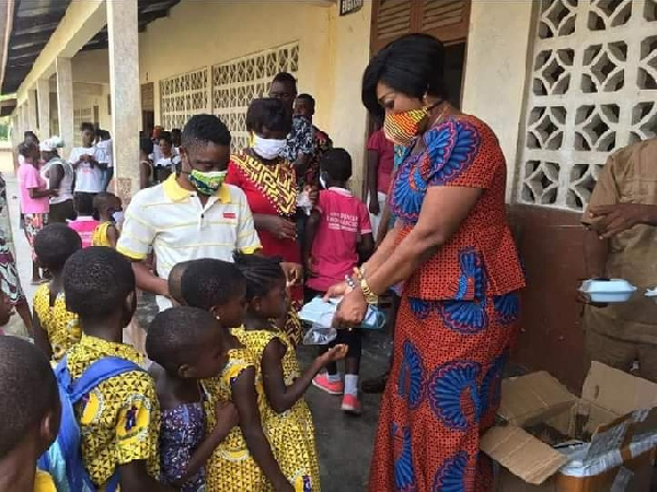 Member of Parliament for Agona East, Queenstar Pokua Sawyerr  ad some students