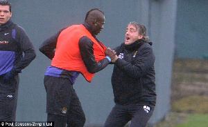 A Photo Of Mario Balotelli And Roberto Manchini