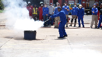 The team taking drills on how to douse fire