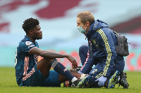 Thomas Partey being attended to by a medic