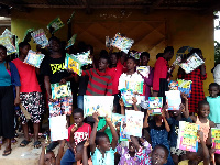 Some of the children display the materials they got