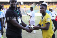 Emmanuel Gyamfi receiving his prize