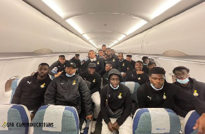 Black Stars in a group photo before disembarking