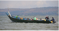 A private boat with passengers leaving Masese landing site in Jinja, Uganda.