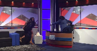 Stephanie Benson doing the 'one corner' dance with host, Master Richard