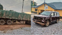 A truck loaded with cement rammed into the driver side of the car tearing parts of the front off