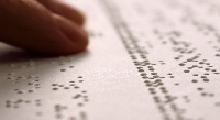 File photo of person using the braille