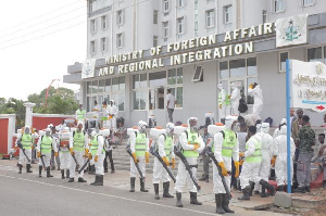 Some officials clad in PPEs engaged in the disinfection exercise at the Foreign Affairs Ministry