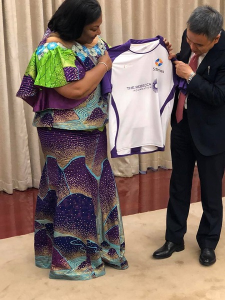 Mrs Rebecca Akufo-Addo receiving a customized Startimes shirt