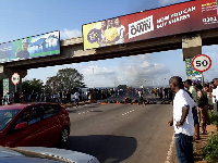 Residents have burnt tyres to block the road in protest