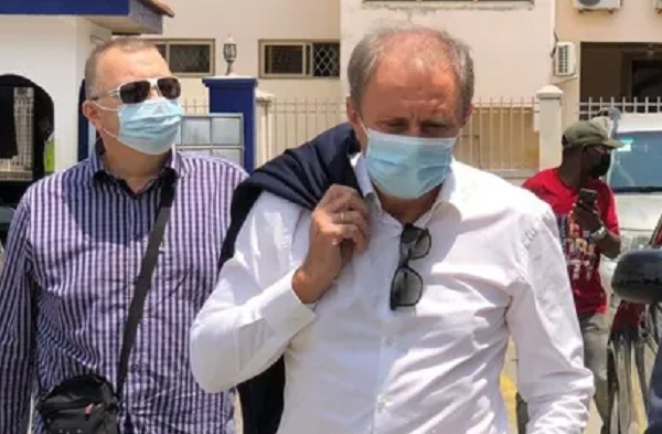 Coach Milovan (right) arrives at GFA HQ with his interpreter