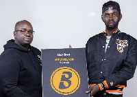 Black Sherif (right) receives his Boomplay plaque