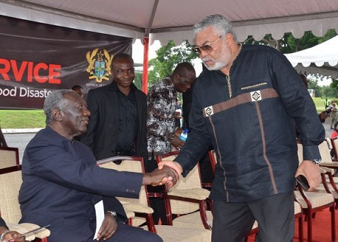 Former Presidents John Agyekum Kufuor (l) and Jerry John Rawlings (r) in a handshake