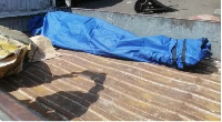 A file photo of a corpse wrapped in a body bag