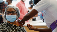 File photo of an individual taking a vaccine