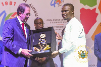 The sports minister receiving his award