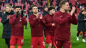 Liverpool team celebrating after a late win against Nottingham Forest