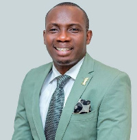 Counsellor Lutterodt in a suit