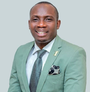 Counsellor Lutterodt in a suit