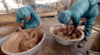 Women process shea butter