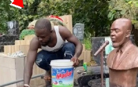 Kofi Boakye bathing his brother's tomb