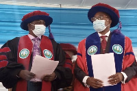 VC Professor Philip Duku Osei with another official at an event